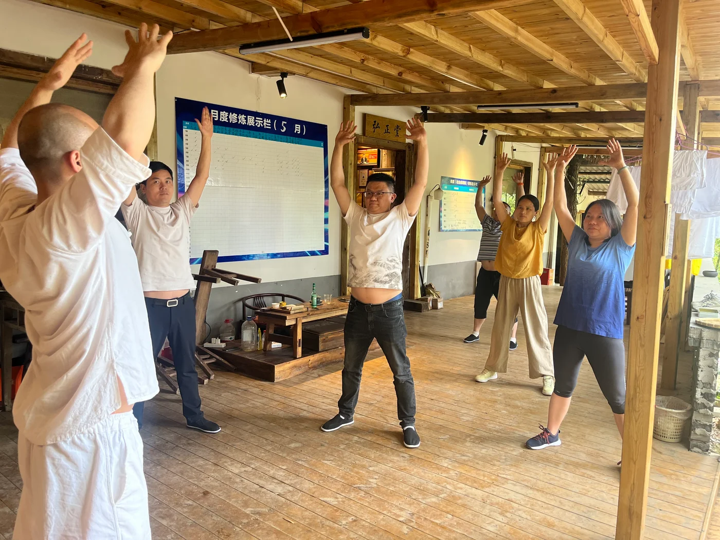 Group practice in a wooden training hall, from the supplied Hong Zheng Tang archive